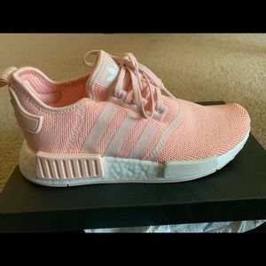 Pink Adidas NMDs athletic shoe